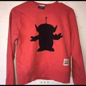 Cute orange sweater with the alien from toy story